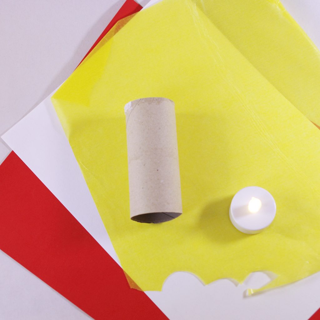 Material für einen Leuchtturm: Klopapierrolle, weißes und rotes Papier, gelbes Transparentpapier und ein LED-Teelicht. 